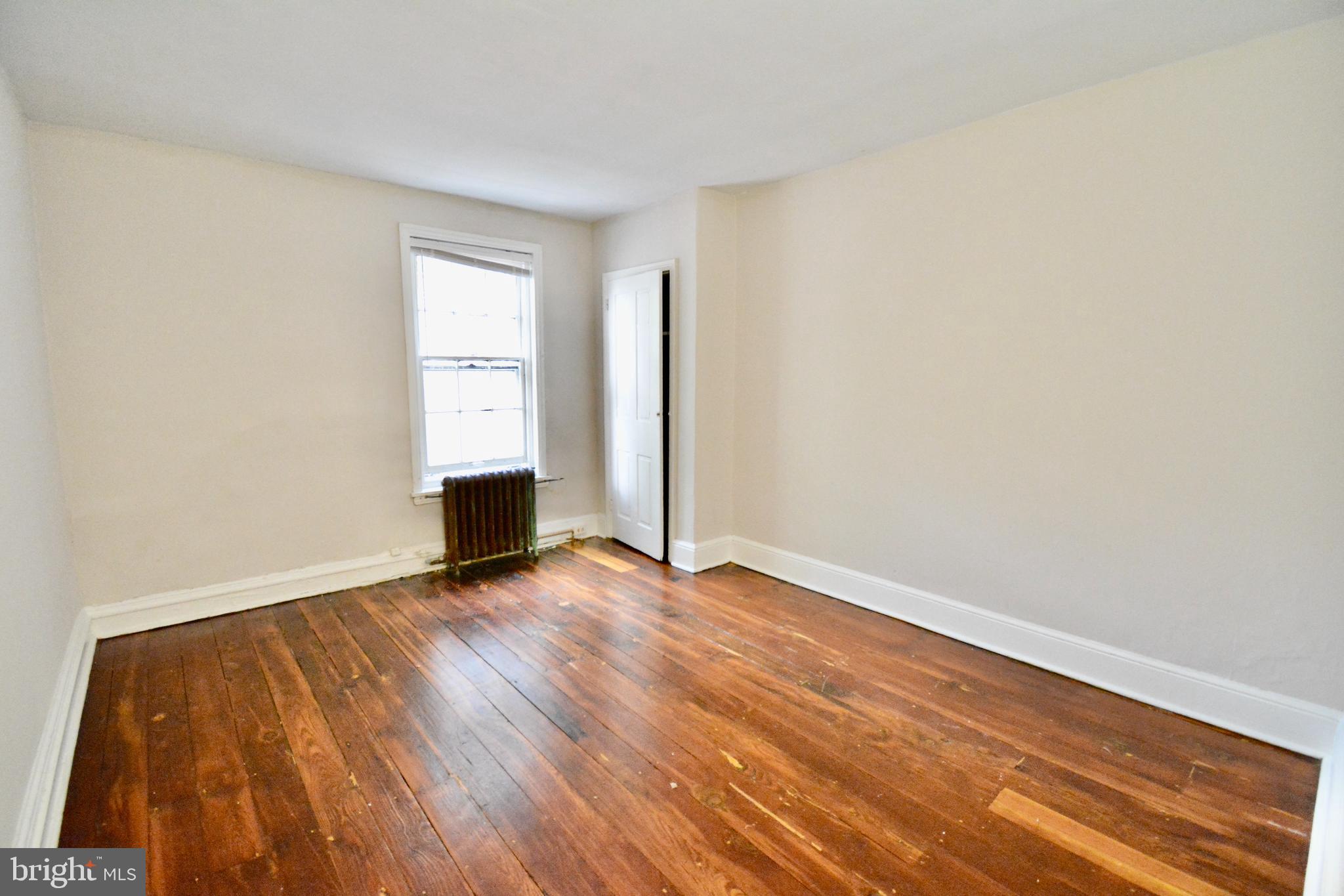 2 Penn Court Philadelphia, PA 19144 - Photo 9 of 13 a view of an empty room with wooden floor and a window