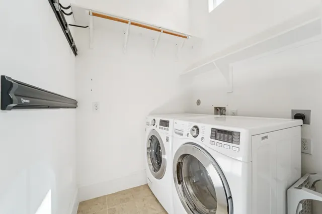 a white toilet sitting next to a shower