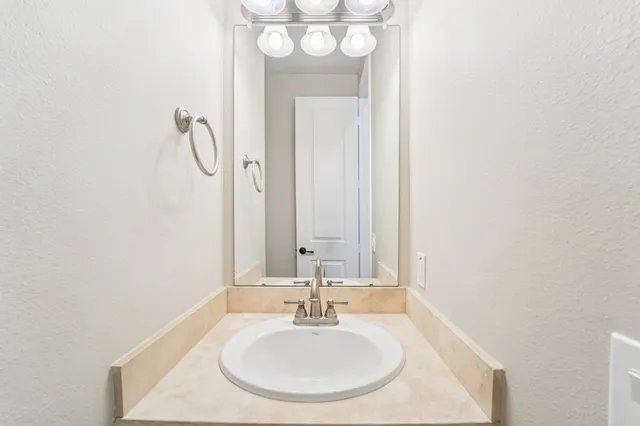 an empty room with closet and windows