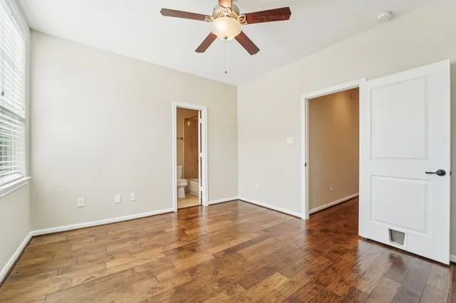 a bathroom with a sink toilet tub vanity and shower