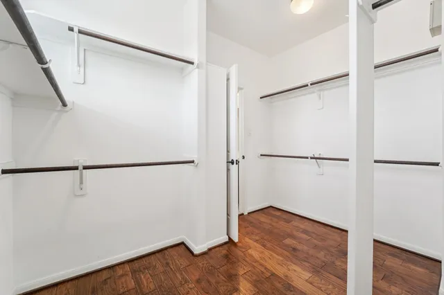 a view of a chair and table in backyard of the house