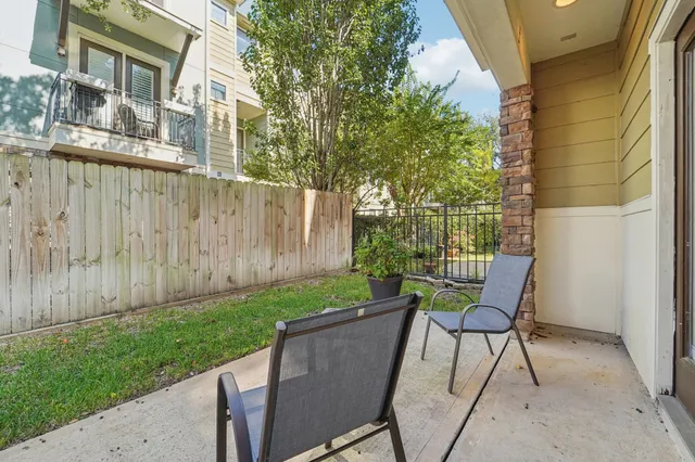 a front view of a house with outdoor seating