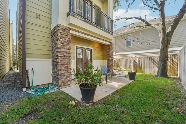 a view of a building with a garden and plants