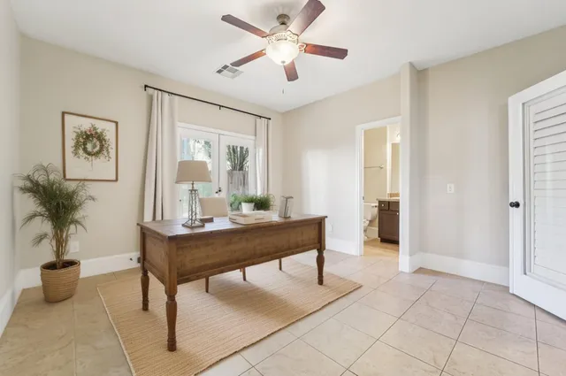 a view of a livingroom with furniture and a potted plant