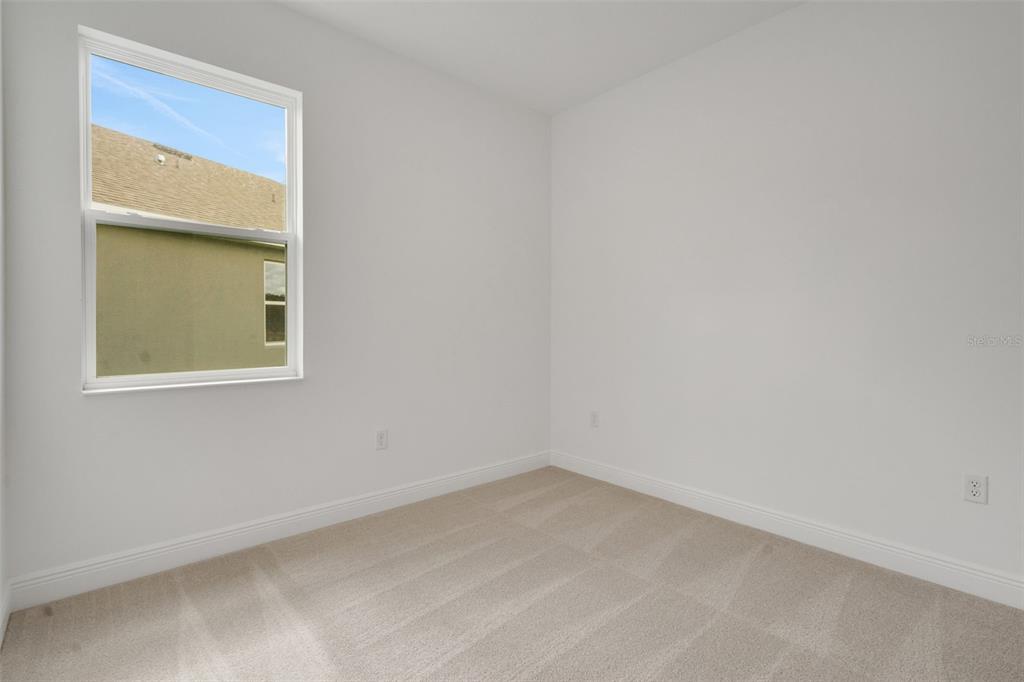 1018 Swamp Chestnut Loop Lady Lake, FL 32159 - Photo 13 of 35 a view of an empty room with a window