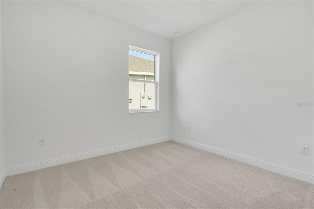 1018 Swamp Chestnut Loop Lady Lake, FL 32159 - Photo 27 of 35 an empty room with a window