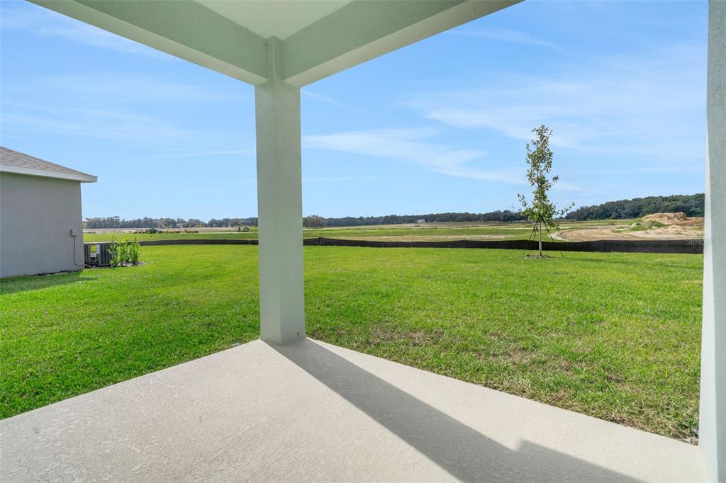1018 Swamp Chestnut Loop Lady Lake, FL 32159 - Photo 32 of 35 a view of a field with an ocean view