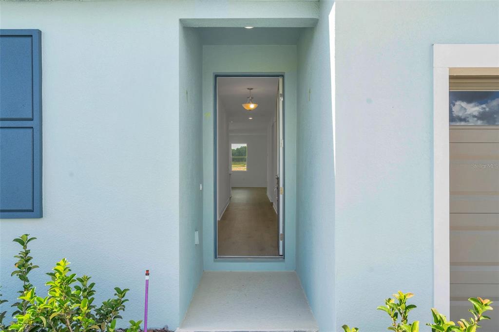 1018 Swamp Chestnut Loop Lady Lake, FL 32159 - Photo 8 of 35 a view of an entryway