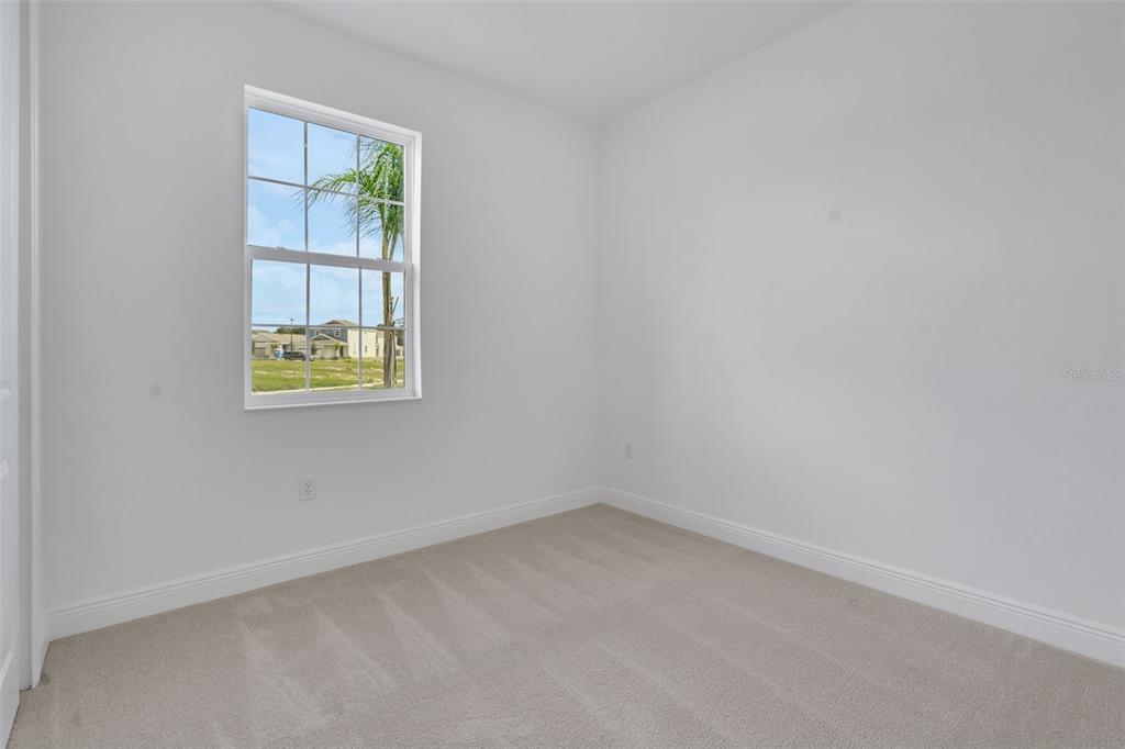 1018 Swamp Chestnut Loop Lady Lake, FL 32159 - Photo 10 of 35 an empty room with a window