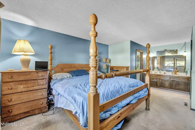 a bed room with a bed and a lamp