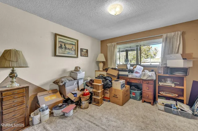 a living room with lots of furniture and a window