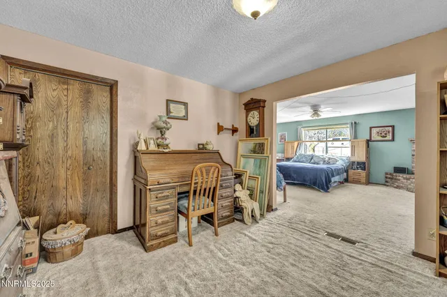 a view of a livingroom with furniture and a window