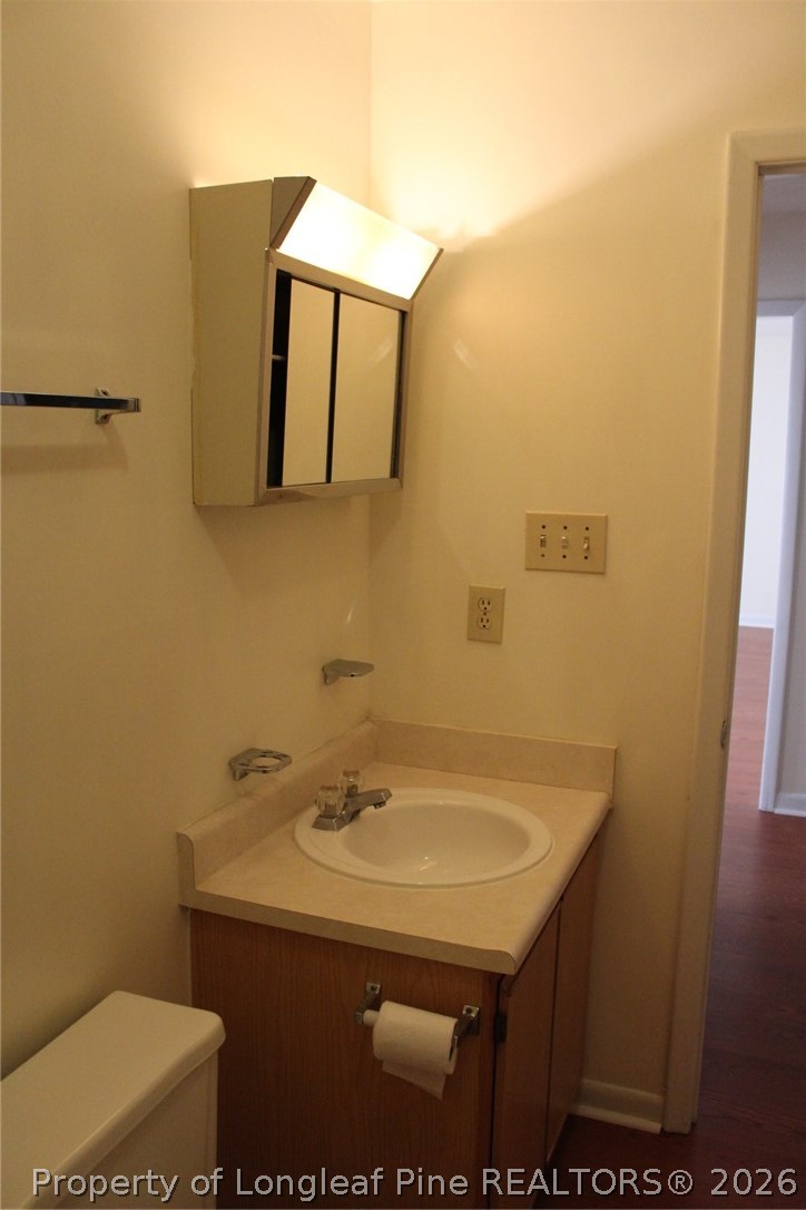 7805 Gallant Ridge Drive Fayetteville, NC 28314 - Photo 17 of 25 a bathroom with a sink and a mirror