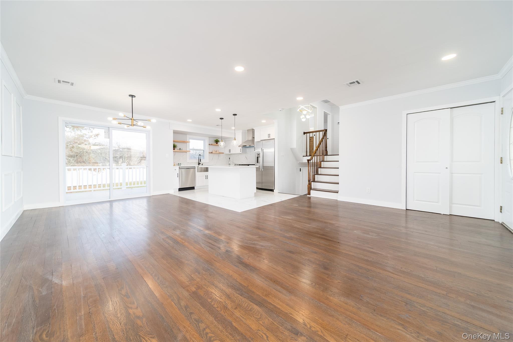 8 Spector Lane Plainview, NY 11803 - Photo 2 of 15 a view of a kitchen with a sink and a window