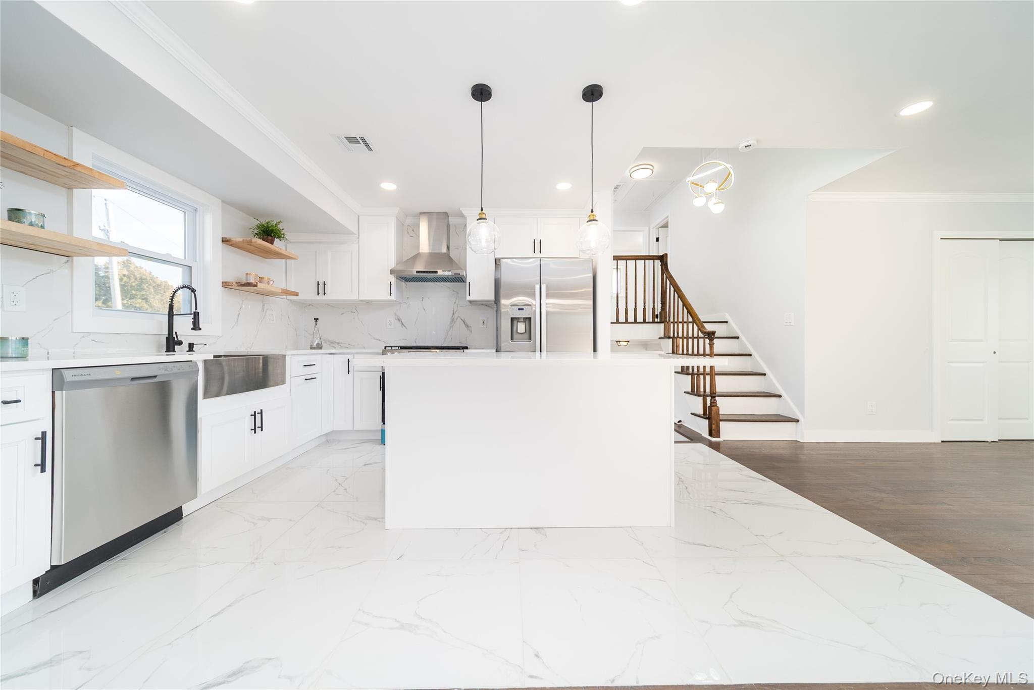 8 Spector Lane Plainview, NY 11803 - Photo 4 of 15 a large white kitchen with lots of white cabinets