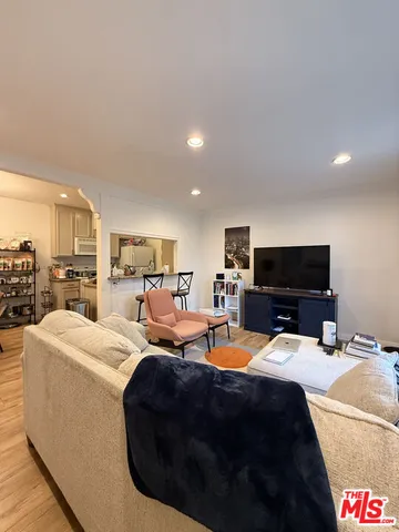 a bedroom with a bed and a television