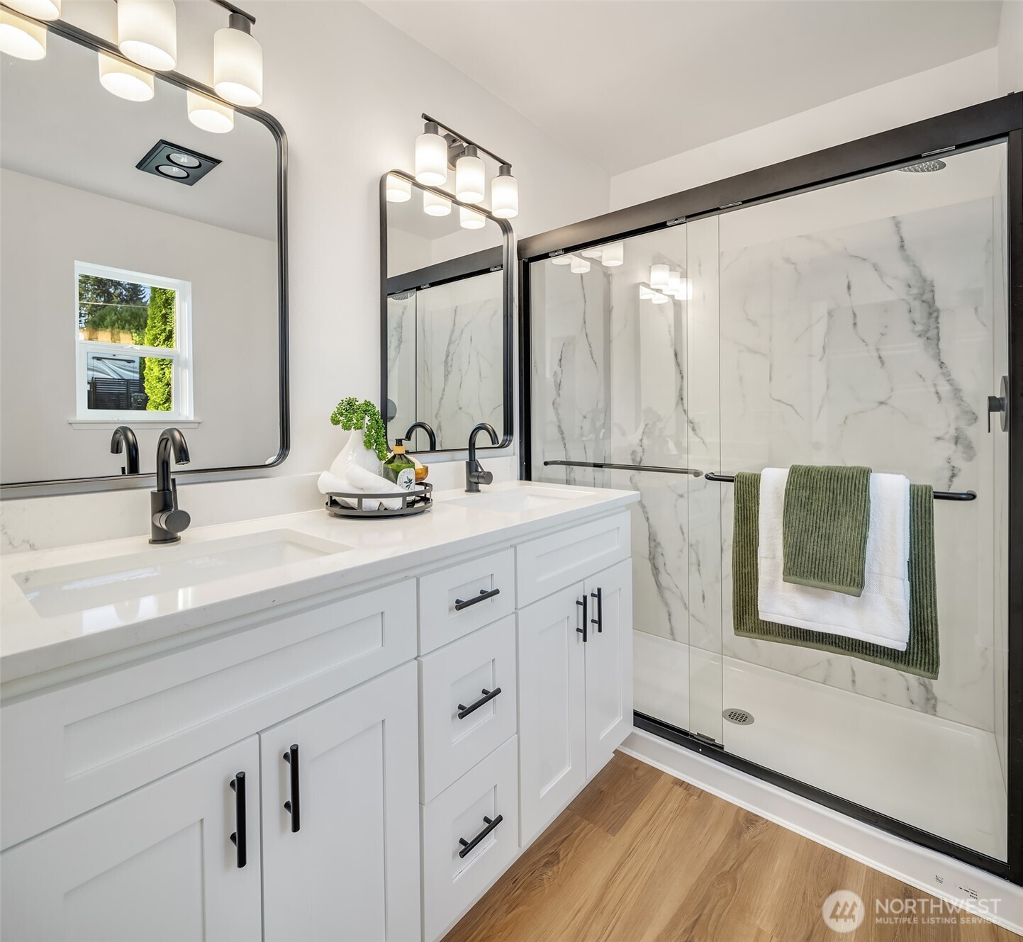 2222 North 29th Street Tacoma, WA 98403 - Photo 14 of 26 a bathroom with a double vanity sink and a mirror