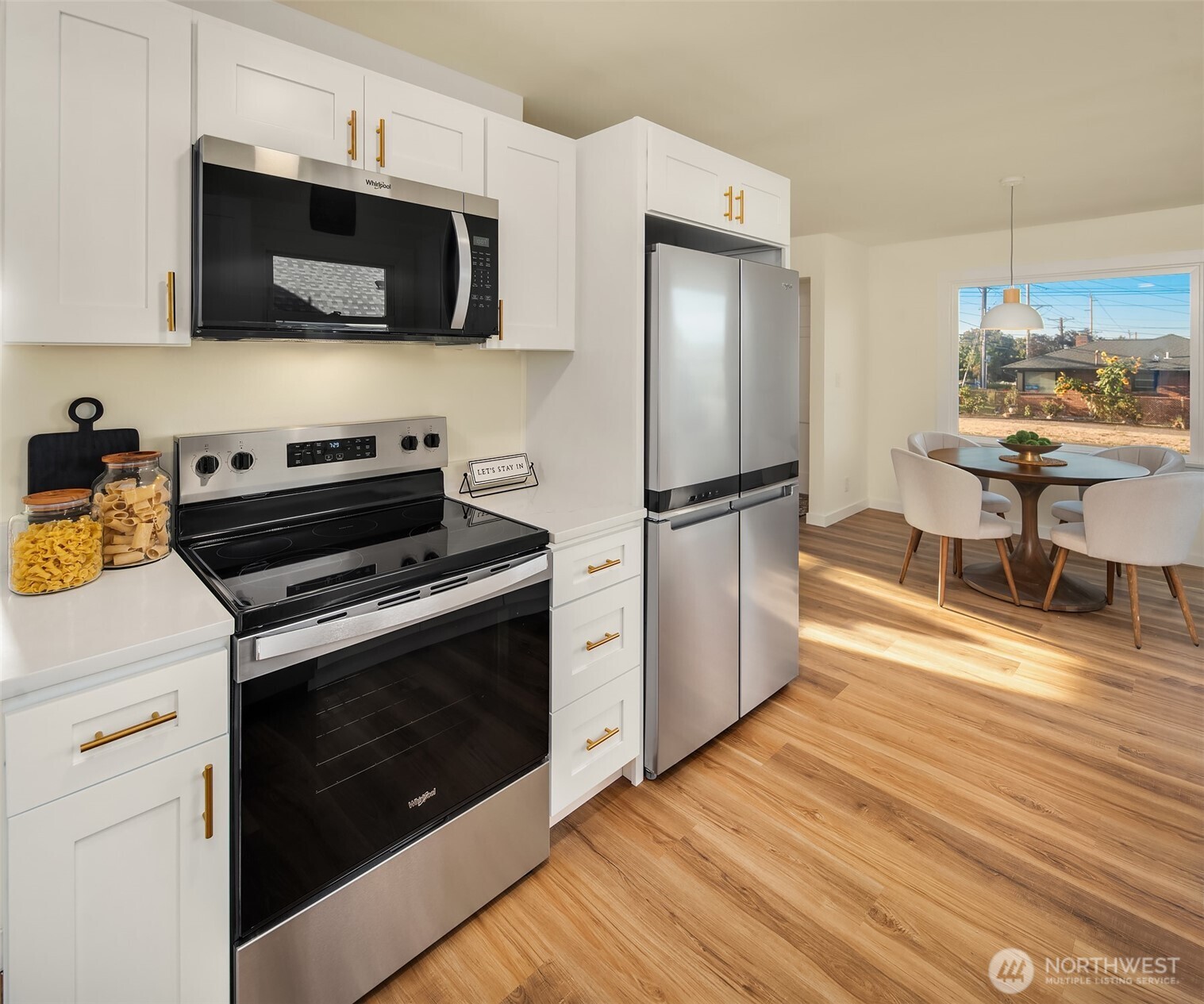 2222 North 29th Street Tacoma, WA 98403 - Photo 5 of 26 a kitchen with stainless steel appliances a stove microwave and refrigerator