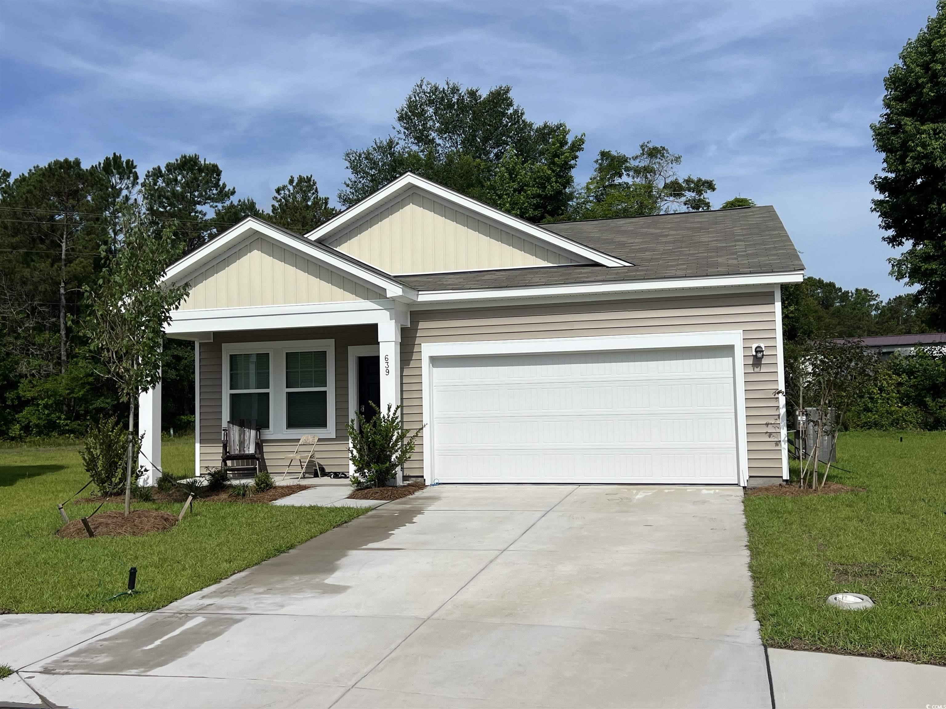 639 Muster Fld Court Conway, SC 29526 - Photo 1 of 6 View of front facade featuring a front lawn, concr