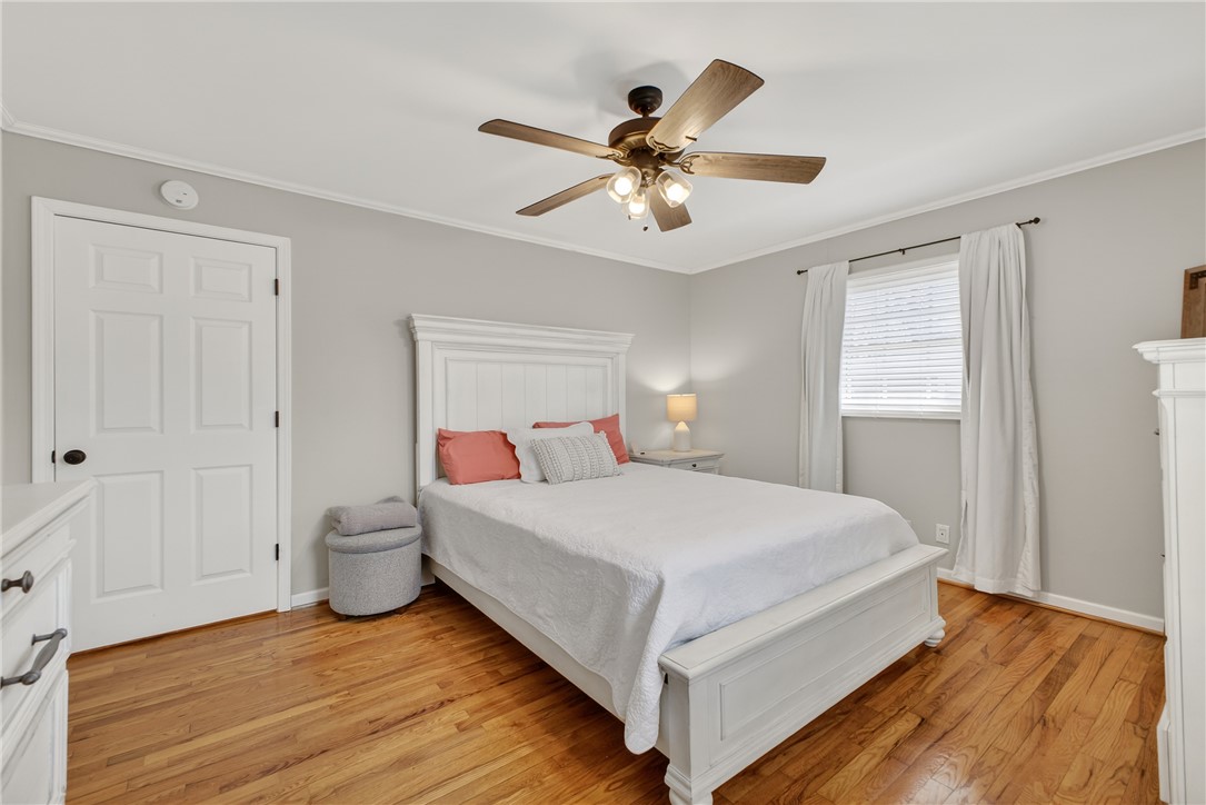 310 Gracie Street Seneca, SC 29678 - Photo 16 of 34 This inviting bedroom features rich hardwood flooring and a stylish ceiling fan.