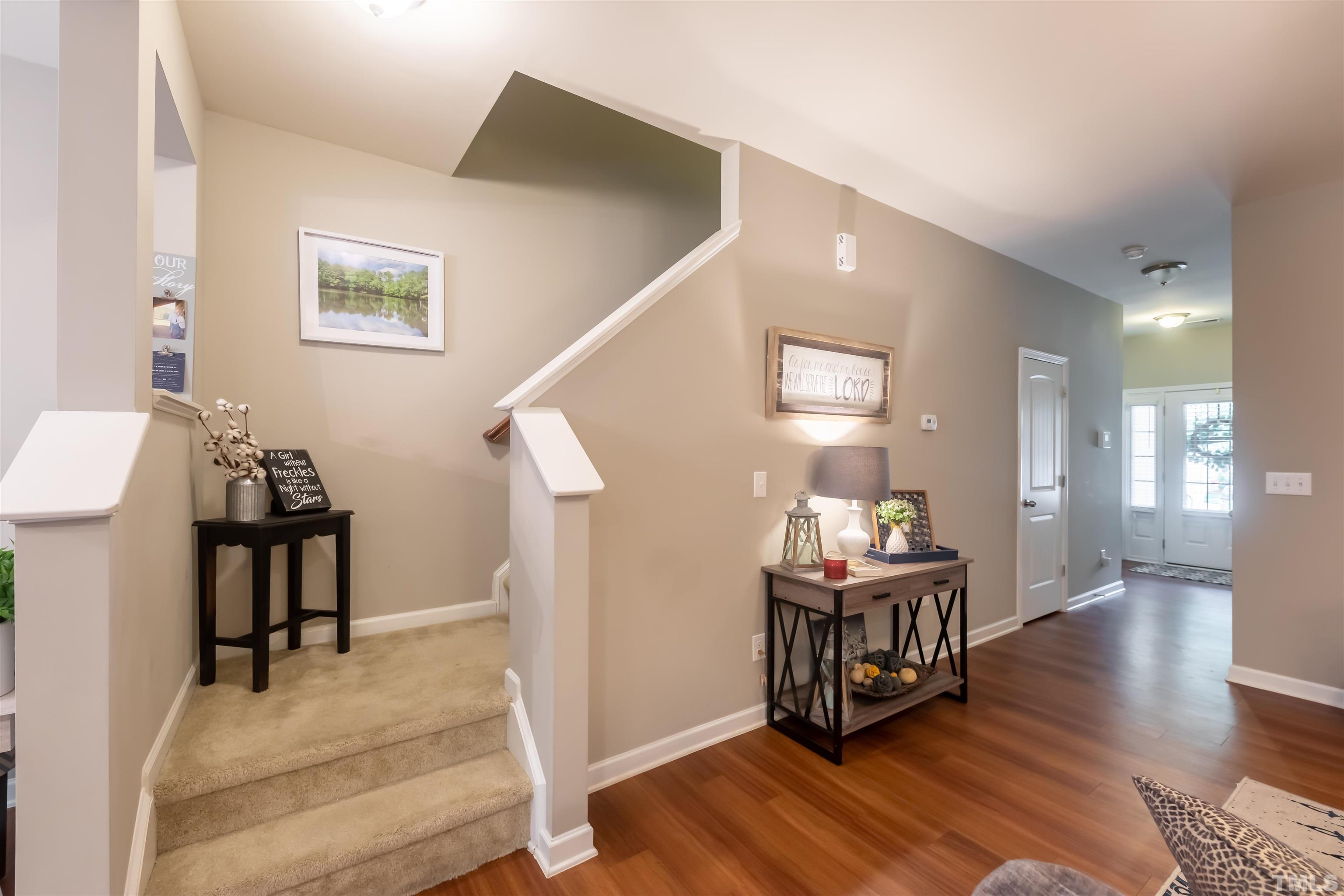 1427 Chatuga Way Wake Forest, NC 27587 - Photo 14 of 36 a dining room with furniture and wooden floor