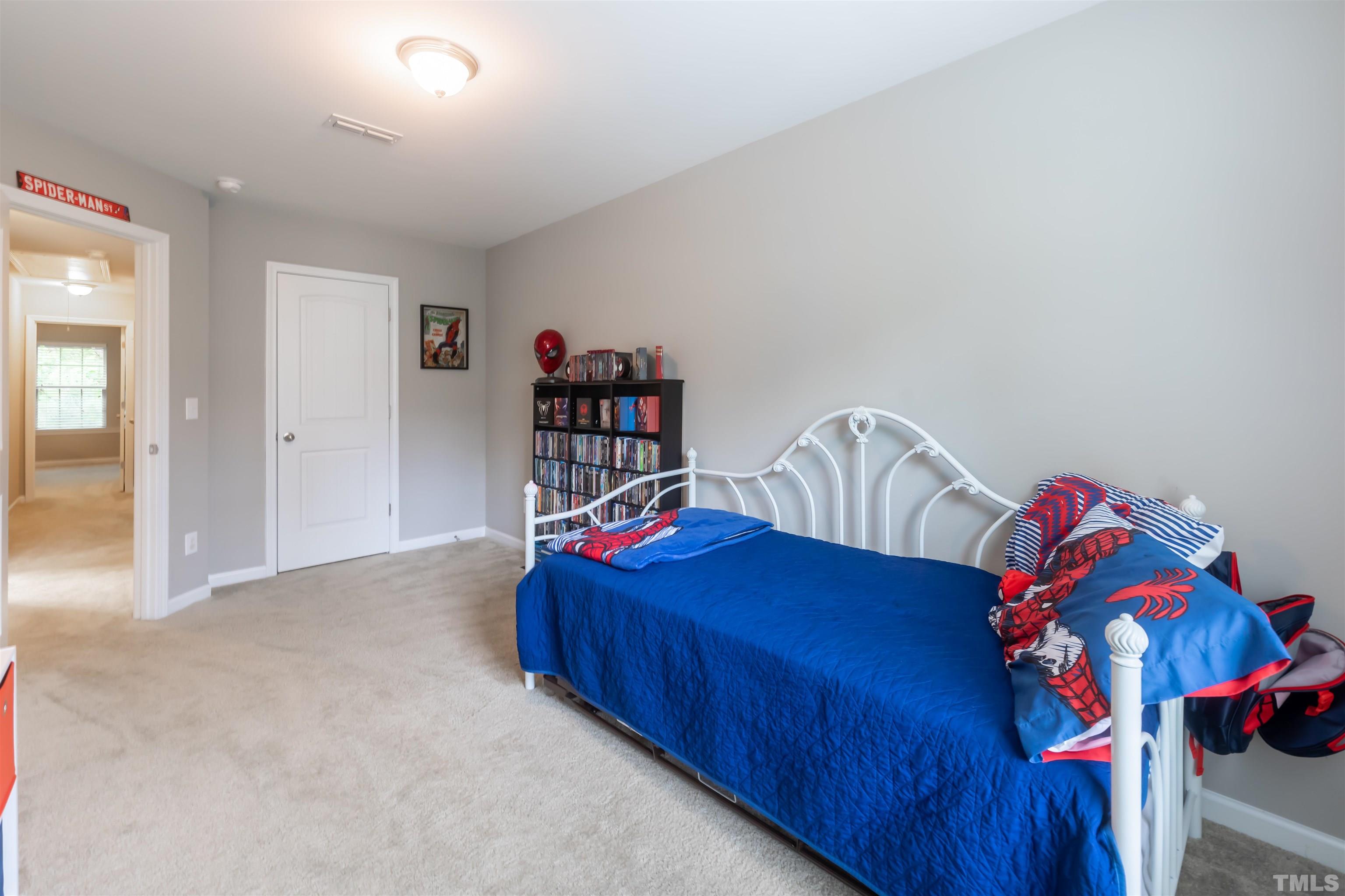1427 Chatuga Way Wake Forest, NC 27587 - Photo 33 of 36 a bedroom with a bed and closet