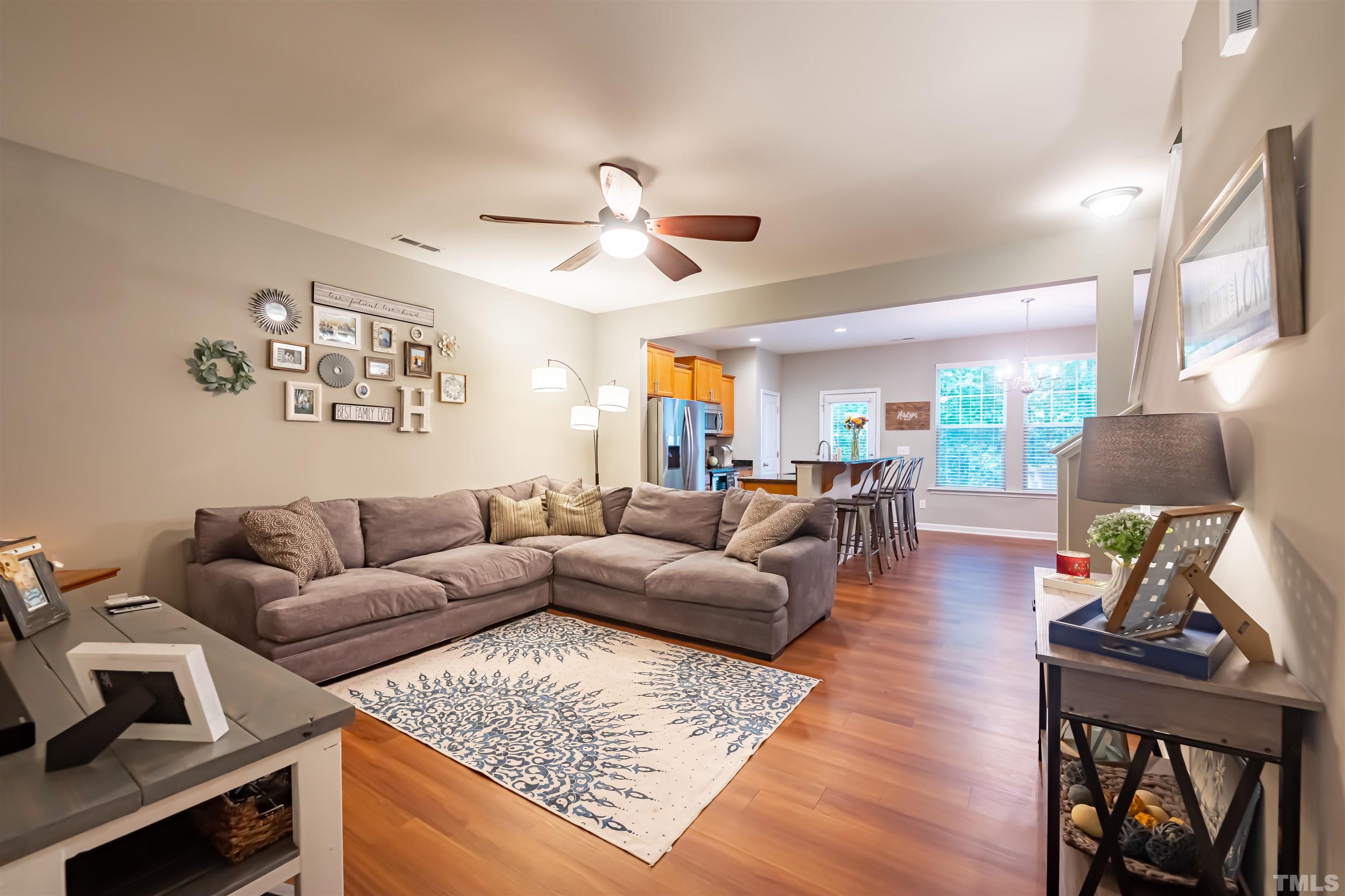 1427 Chatuga Way Wake Forest, NC 27587 - Photo 4 of 36 a living room with furniture and a wooden floor