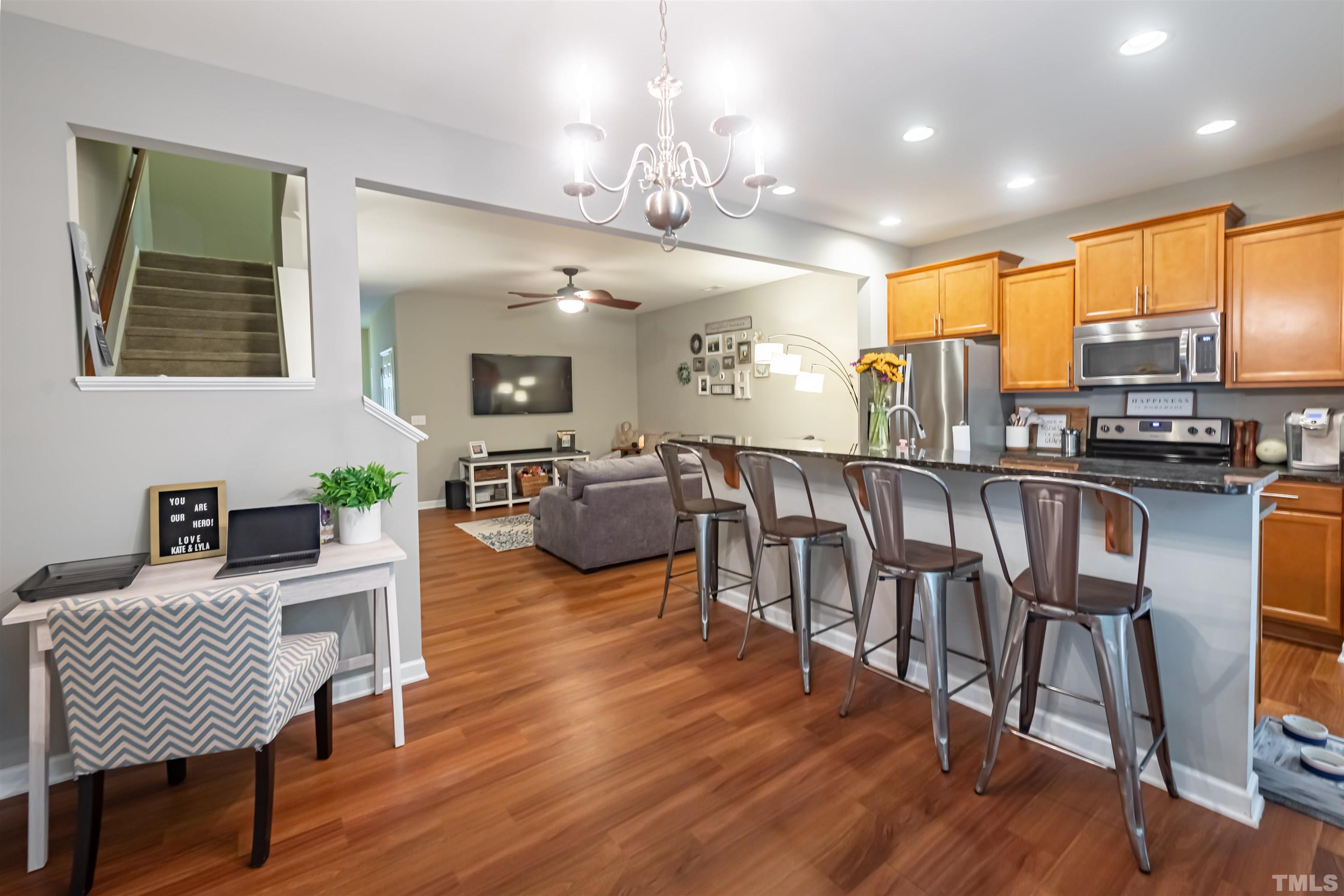 1427 Chatuga Way Wake Forest, NC 27587 - Photo 7 of 36 a view of a dining room with furniture window and wooden floor