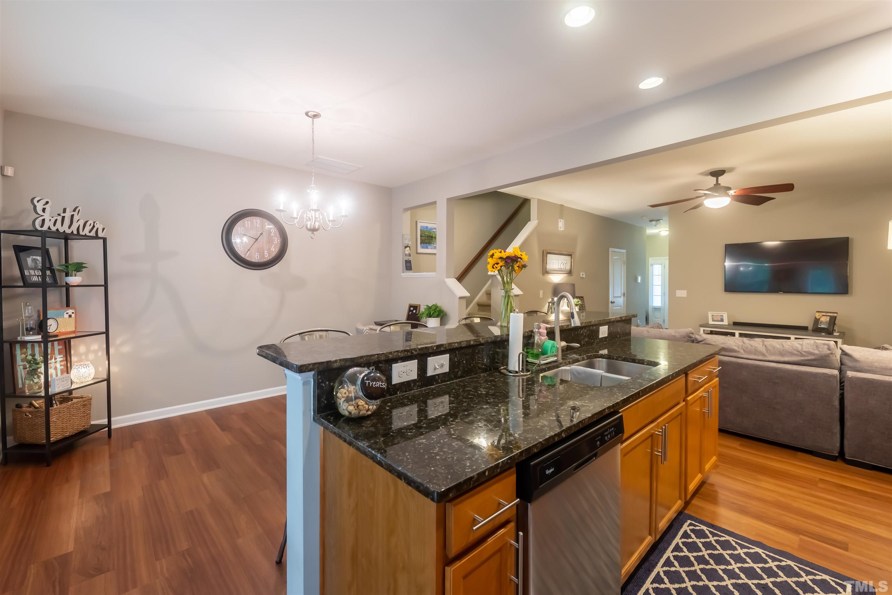 1427 Chatuga Way Wake Forest, NC 27587 - Photo 9 of 36 a kitchen with stainless steel appliances granite countertop a sink and a stove