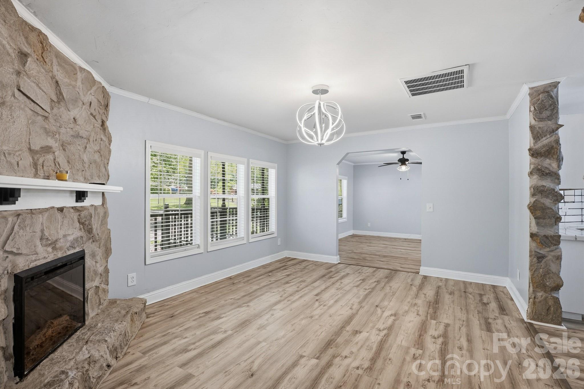 116 Springdale Drive York, SC 29745 - Photo 10 of 32 a view of an empty room with a fireplace and a window
