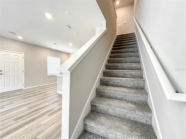 an empty room with closet and windows