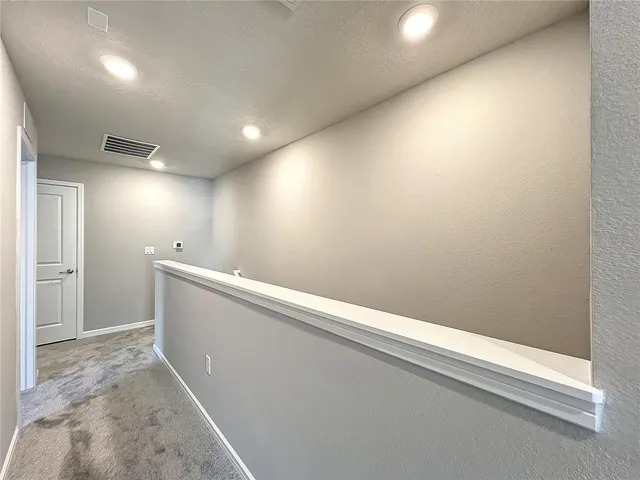 a front view of a house with a yard table and chairs