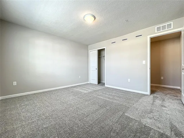 a front view of a house with a yard table and chairs