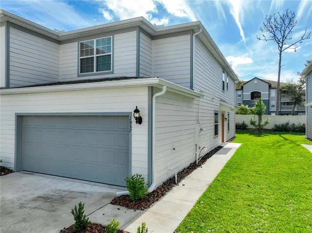 a view of a back yard of the house