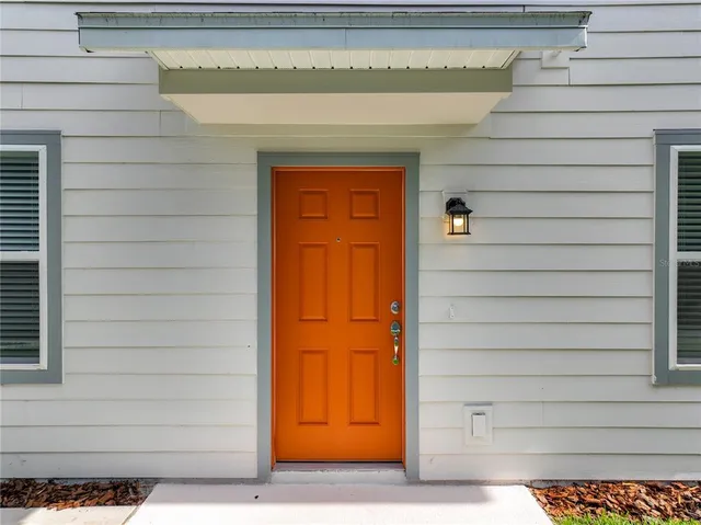 a large kitchen with stainless steel appliances granite countertop a sink and dishwasher with wooden floor