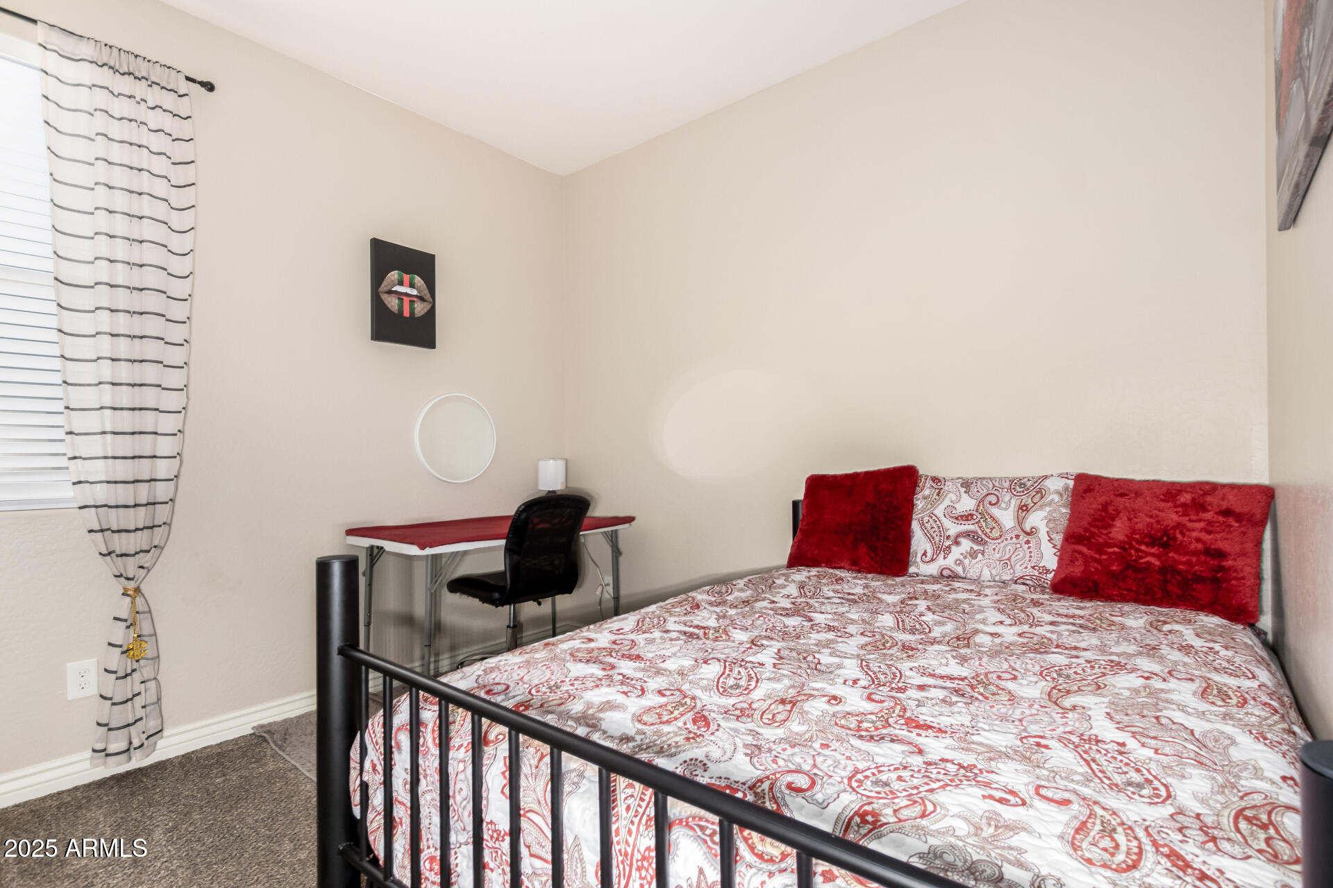 10637 West Crown King Road Tolleson, AZ 85353 - Photo 12 of 19 a bedroom with a bed and wooden floor