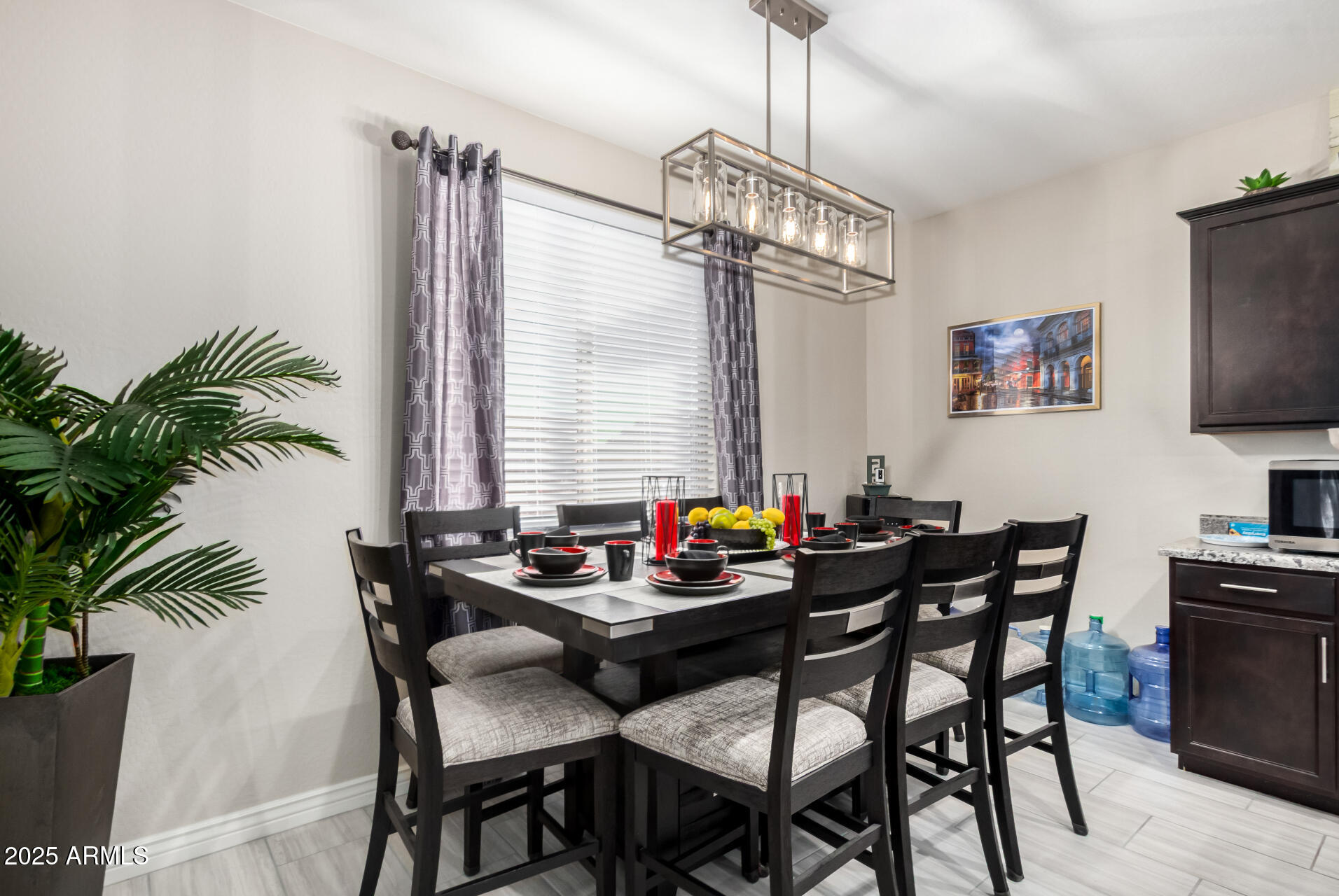 10637 West Crown King Road Tolleson, AZ 85353 - Photo 7 of 19 a table and chairs in a room