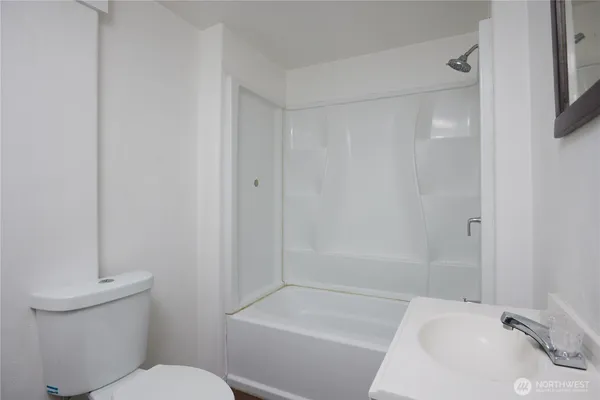 a bathroom with a sink and toilet