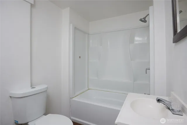 a bathroom with a sink and toilet