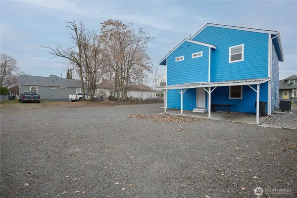 a front view of a house with a yard and a garage
