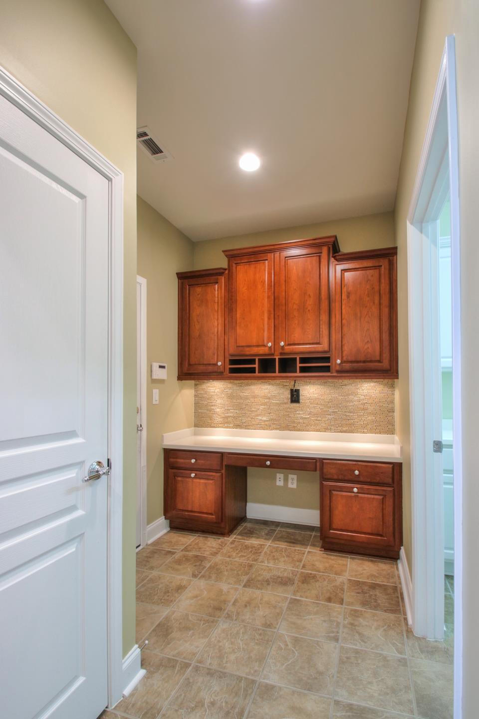 512 Bugler Road Mount Juliet, TN 37122 - Photo 8 of 30 a view of kitchen with granite countertop a sink and dishwasher in a closet