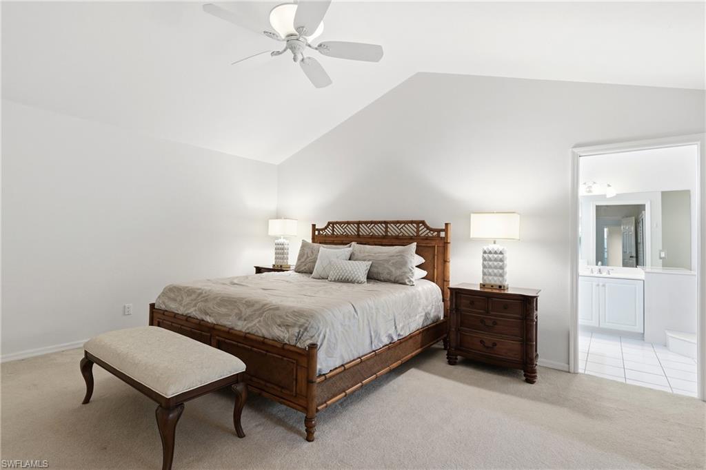 203 Via Perignon, Unit 24 Naples, FL 34119 - Photo 17 of 42 Primary Bedroom leading to Primary Bathroom and lanai