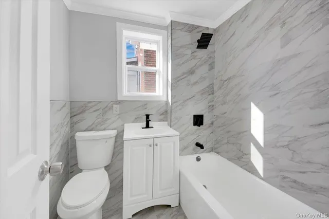 a bathroom with a toilet sink and bathtub