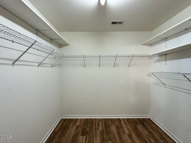 a view of a room with racks on the wall