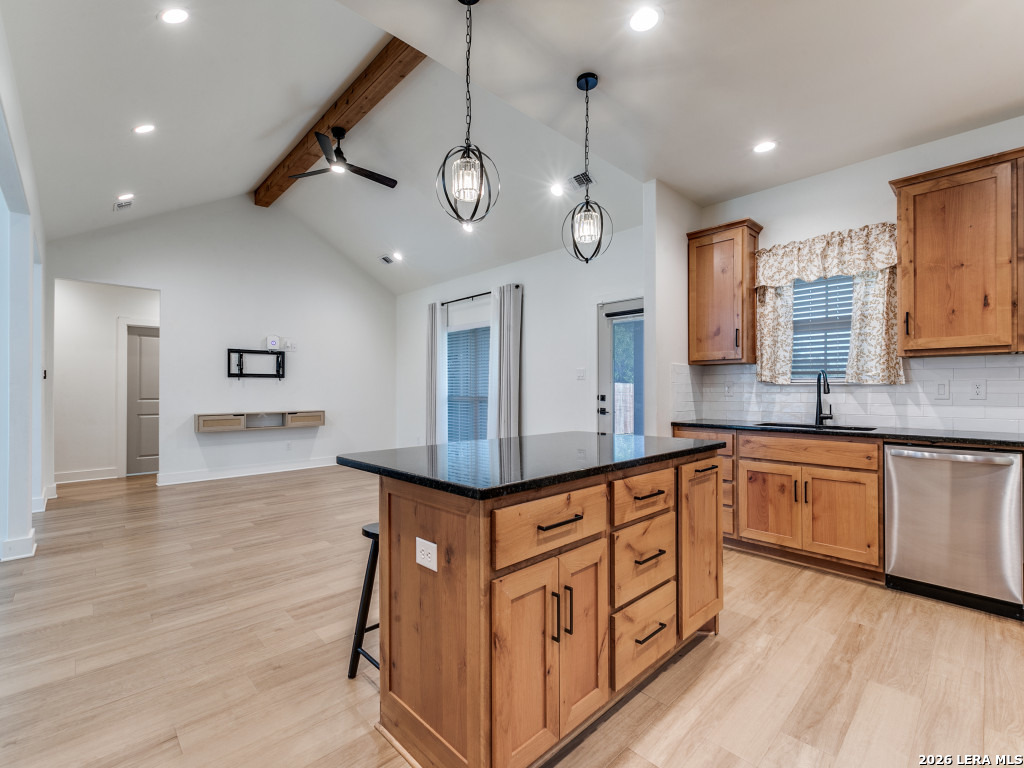 1015 Timbercrest Pleasanton, TX 78064 - Photo 12 of 26 a kitchen with stainless steel appliances granite countertop a sink a stove and a wooden floors