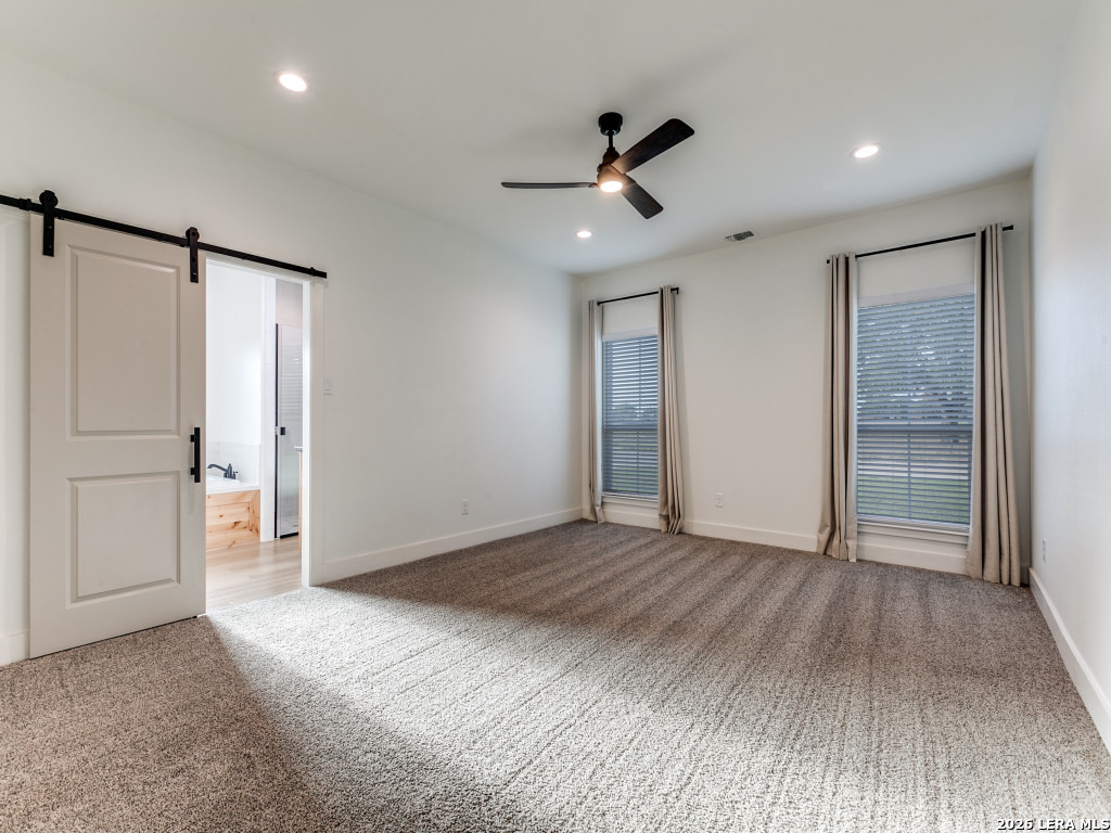1015 Timbercrest Pleasanton, TX 78064 - Photo 14 of 26 a view of empty room with wooden floor and fan