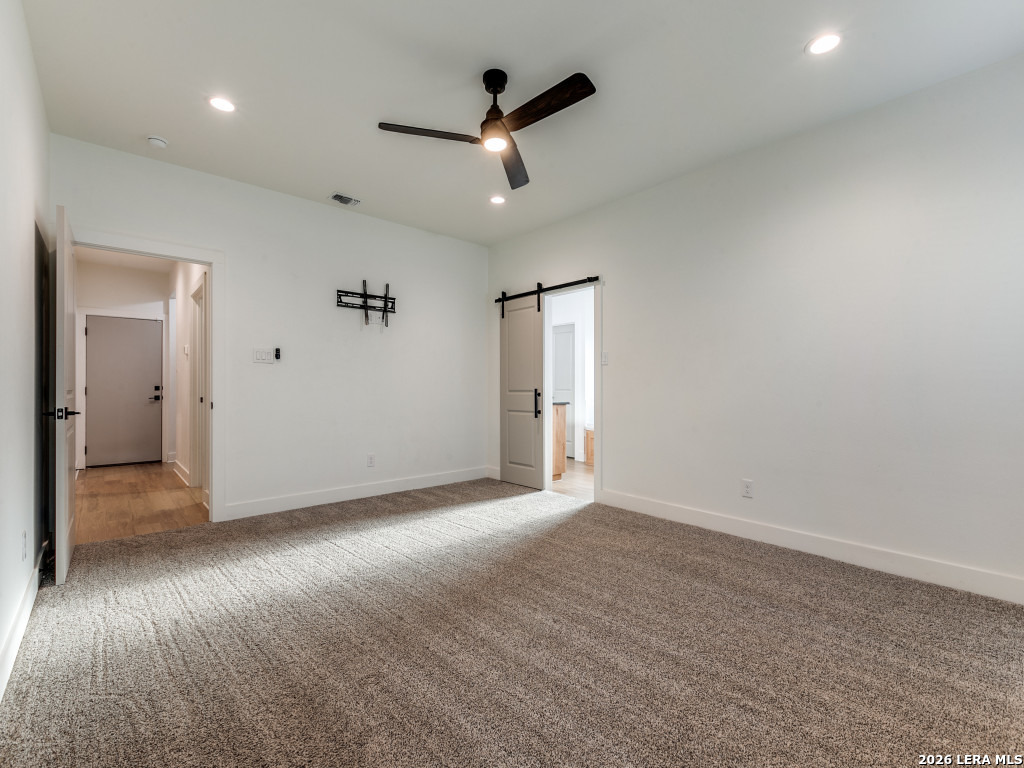 1015 Timbercrest Pleasanton, TX 78064 - Photo 15 of 26 an empty room with ceiling fan and window