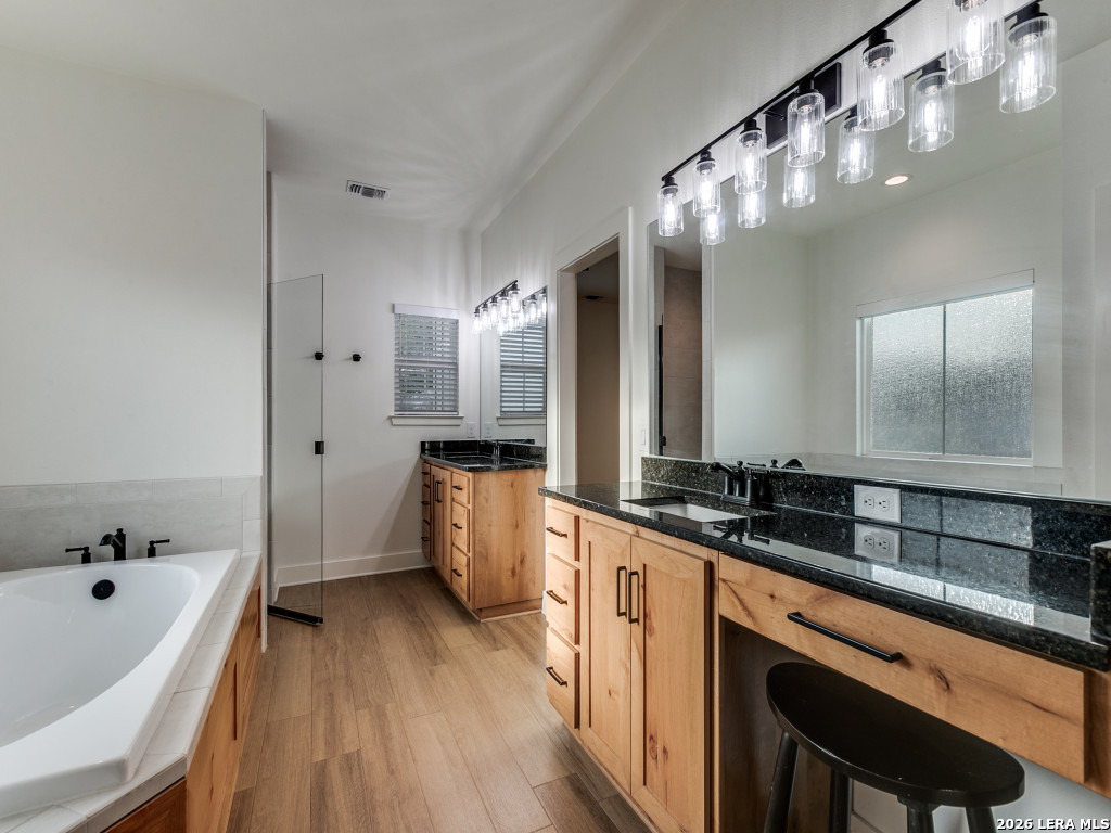 1015 Timbercrest Pleasanton, TX 78064 - Photo 16 of 26 a large kitchen with a sink and refrigerator