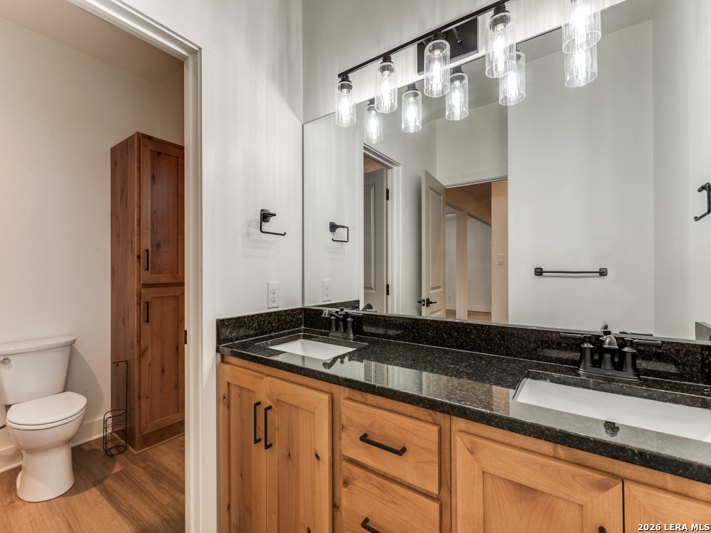 1015 Timbercrest Pleasanton, TX 78064 - Photo 22 of 26 a bathroom with a sink and a mirror