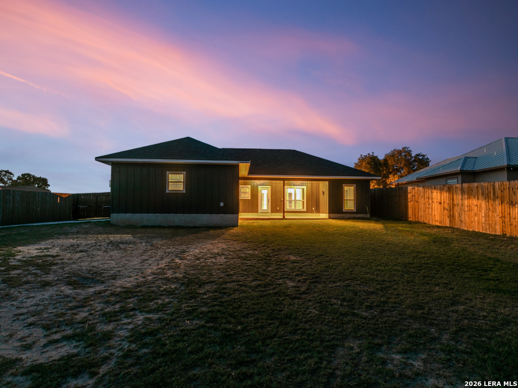 1015 Timbercrest Pleasanton, TX 78064 - Photo 26 of 26 a front view of a house with a yard